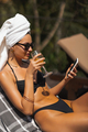 Drinking Luxury Woman With Smart Phone During Summer Vacations at the Pool - PhotoDune Item for Sale