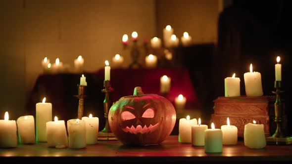 Jackolantern and Burning Candles Closeup