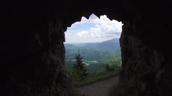 View of the Green Hills From the Dark Cave