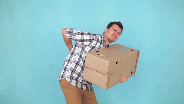 Portrait of a Man Carrying Weights Have Problems or Severe Back Pain