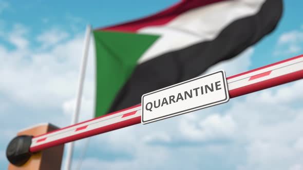 Open Boom Gate with QUARANTINE Sign at the Flag of Sudan