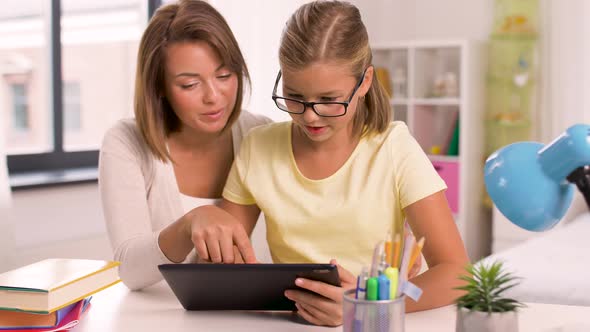 Mother and Daughter with Tablet Pc Doing Homework 13