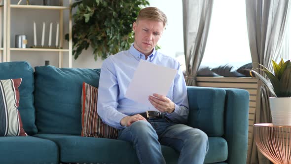 Penisve Middle Aged Man Reading Documents Paper Work