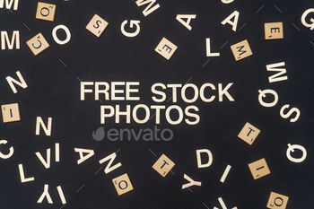 FREE STOCK PHOTOS word written on dark paper background. FREE STOCK PHOTOS text for your concepts