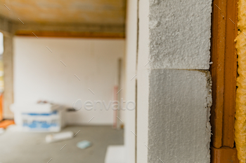 Selective focus shot of an indoor construction site with construction material