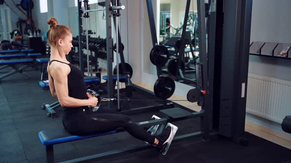 Sporty Woman in a Fitness Club