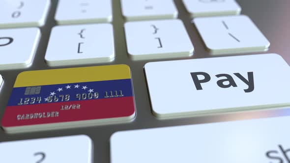 Bank Card with Flag of Venezuela As a Key on Keyboard alt