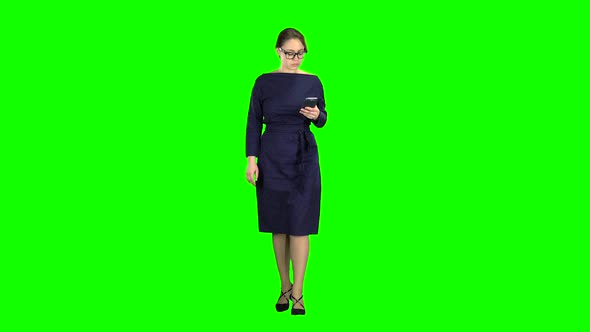 Girl Is Holding the Phone Dials the Message and Paces. Green Screen