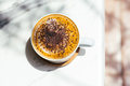 Top view of powdered coffee on marble table with beautiful shadows. - PhotoDune Item for Sale