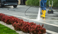 Worker Power Washing Residential Driveway - PhotoDune Item for Sale