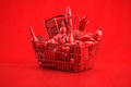 Red shopping basket full of grocery foods on red background. - PhotoDune Item for Sale