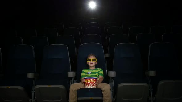 Smiling Little Boy Watching Movie in a Cinema, 3D Glasses