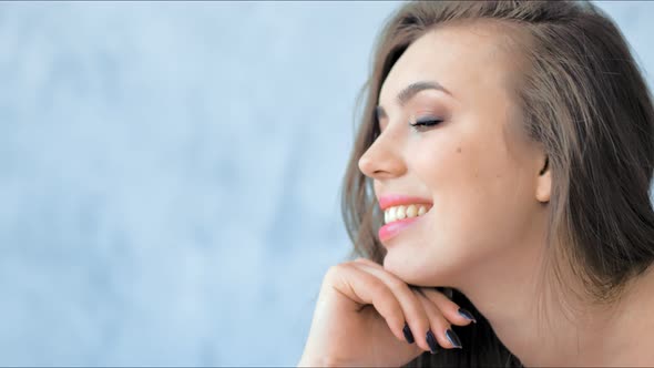 Fashion Model with Professional Beauty Makeup Posing in Studio