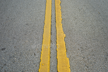 old asphalt road texture with two double yellow line