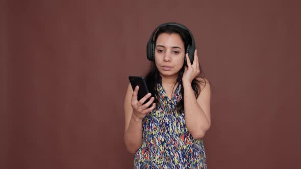 Young Adult Listening to Radio Music on Wireless Headset