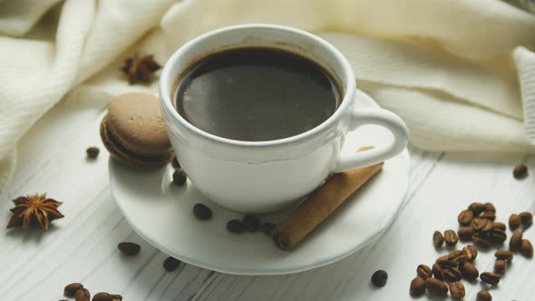 Cup of Coffee with Spices and Macaron