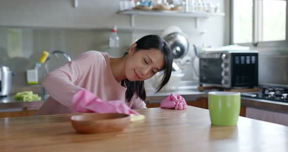 Housewife cleaning the table