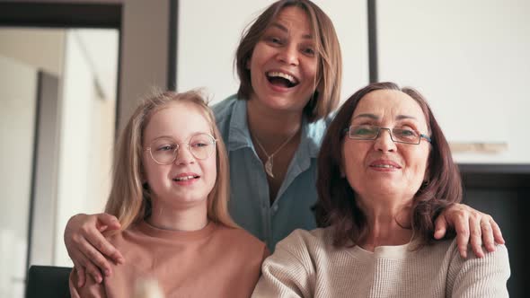 Close Up Portrait of Overjoyed Three Generations of Women Make a Video Call