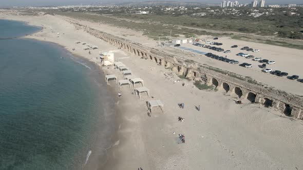 Ancient Aqueduct on the Beach in the City of Caesarea Israel Drone Shot