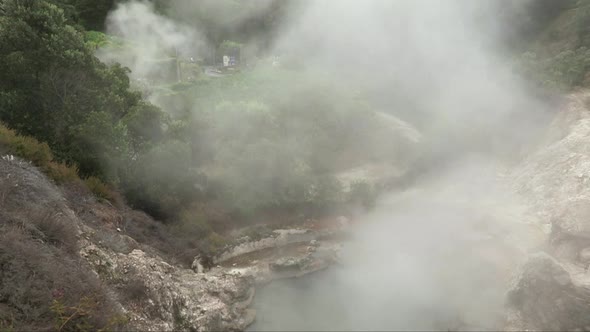 steam from fumarole in Furnas Hot Springs, active geothermal site in Sao Miguel Island, Azores, Port