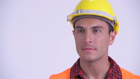 Face of Young Happy Hispanic Man Construction Worker Thinking