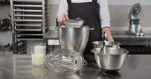 The Confectioner Sifts the Flour Into a Special Container for Dessert