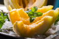 Closeup of cantaloupe melon slices with mint and ice  - PhotoDune Item for Sale