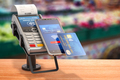 Contactless  payment with smart phone. POS terminal with NFC mobile phone in asupermarket. - PhotoDune Item for Sale