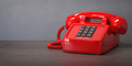Red telephone on a wooden table. - PhotoDune Item for Sale
