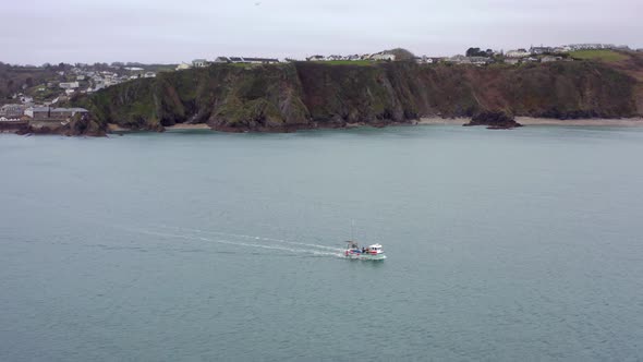 Fishing Boat Heading Out to Sea in Cornwall UK