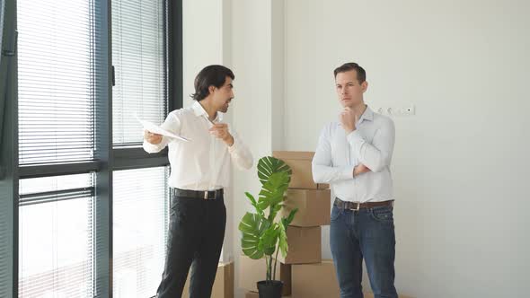 Thoughtful Customer Man Think About Purchase Of New House Real Estate Agent Talking