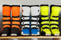 Motorcycle equipment in the form of boots in a motorcycle shop. - PhotoDune Item for Sale