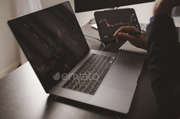nvestor trading stocks, stock market analysis for profitable trading, investing in cryptocurrencies. Concept of investing in stocks.