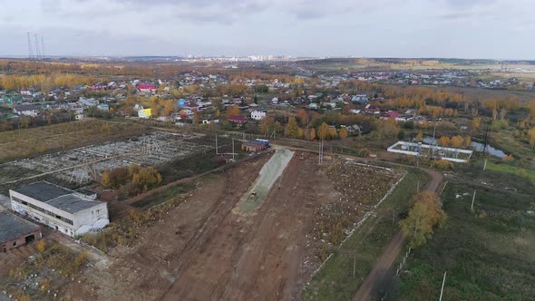 Aerial view of Construction site on the outskirts of the village. 12