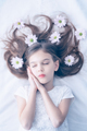 Beautiful girl with closed eyes and flowers in the hair - PhotoDune Item for Sale