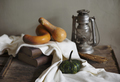 Autumn still life with vintage lantern and pumpkin vegetable on rustic wooden table.  - PhotoDune Item for Sale