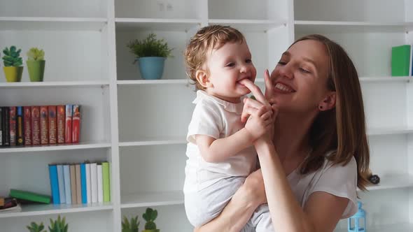 Young Happy Mother Enjoying Time with Baby