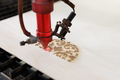 CNC Laser cutting wood. Laser cuts from plywood in production. - PhotoDune Item for Sale