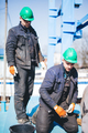 Manual workers working at shipyard construction site - PhotoDune Item for Sale