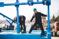 Manual workers working at shipyard construction site - PhotoDune Item for Sale