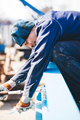 Manual worker working at shipyard construction site - PhotoDune Item for Sale