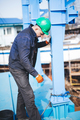 Manual worker working at shipyard construction site - PhotoDune Item for Sale