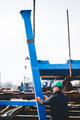 Manual worker working at shipyard construction site - PhotoDune Item for Sale