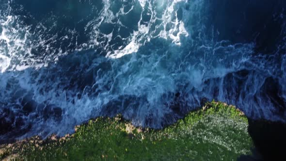 Top Down View on Girl in Natural Pool Between Rock