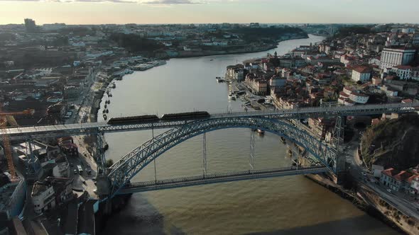 Shuttle Tram Rides on Ponte Luis Metal Bridge Over River