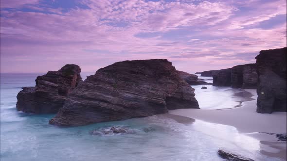 Ocean At Low Tide. Cathedrals Beach In Spain. Timelapse