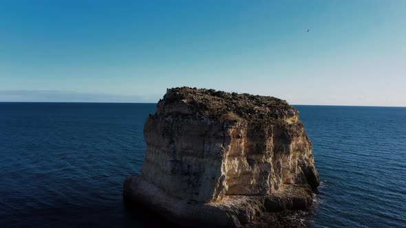 Single rock in ocean