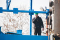 Manual worker working at shipyard construction site - PhotoDune Item for Sale