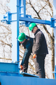 Manual workers working at shipyard construction site - PhotoDune Item for Sale
