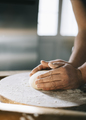 Man kneading and baking homemade pizza dough in the kitchen. - PhotoDune Item for Sale